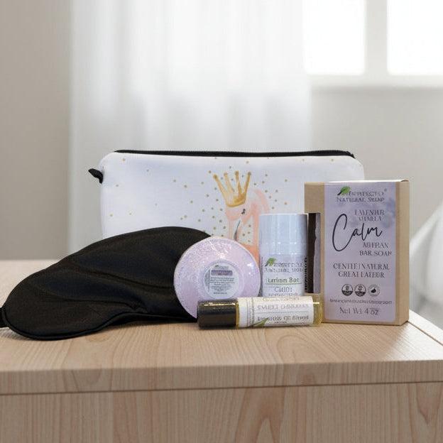 Collection of natural skincare products including soap, lotion bar, and essential oil blend on a countertop.