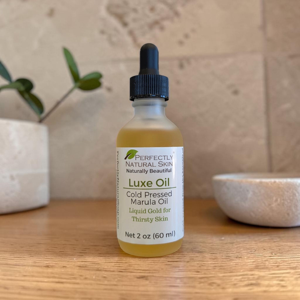 Luxe Oil cold pressed marula oil in a 2 oz glass dropper bottle, pure single-ingredient facial oil