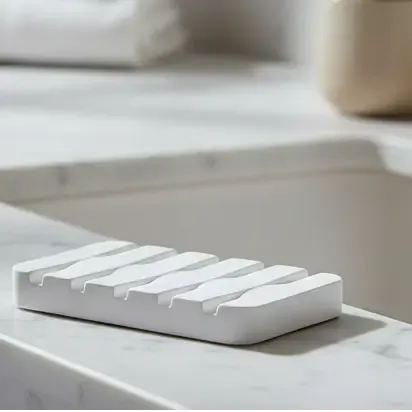 Stack of white folded towels on a white background